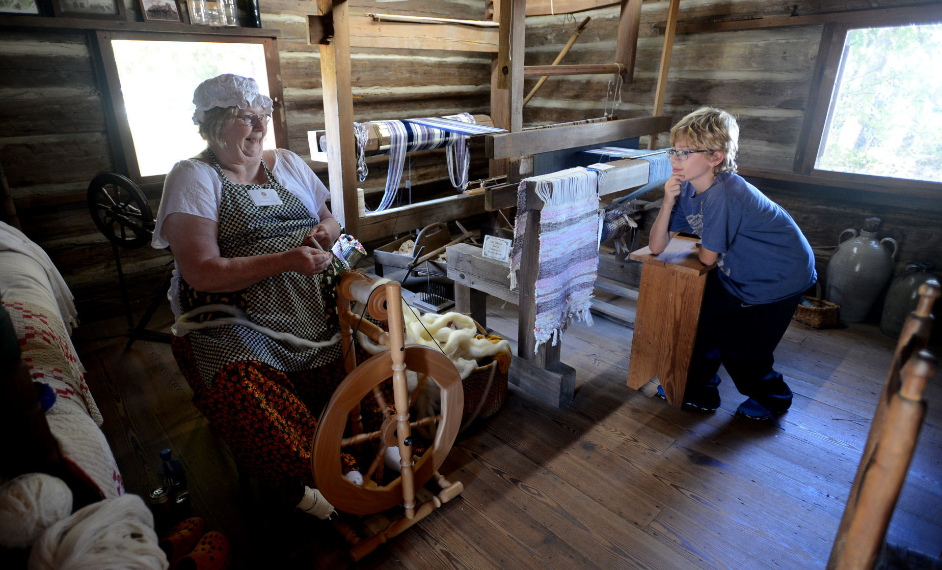 Nancy Farina gives a spinning demonstration during the 2017 Shaw House Fair.